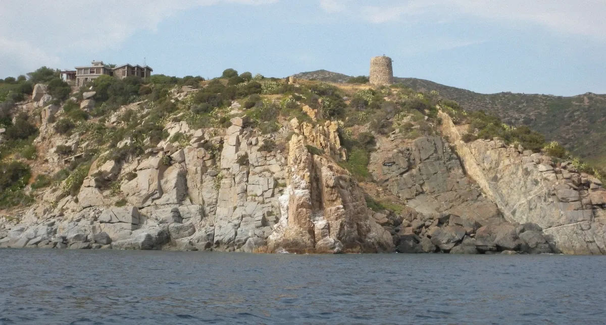 Torre di Cala Regina tower on the coast east of Cagliari under an autumn sky on the Gulf of Cagliari coast