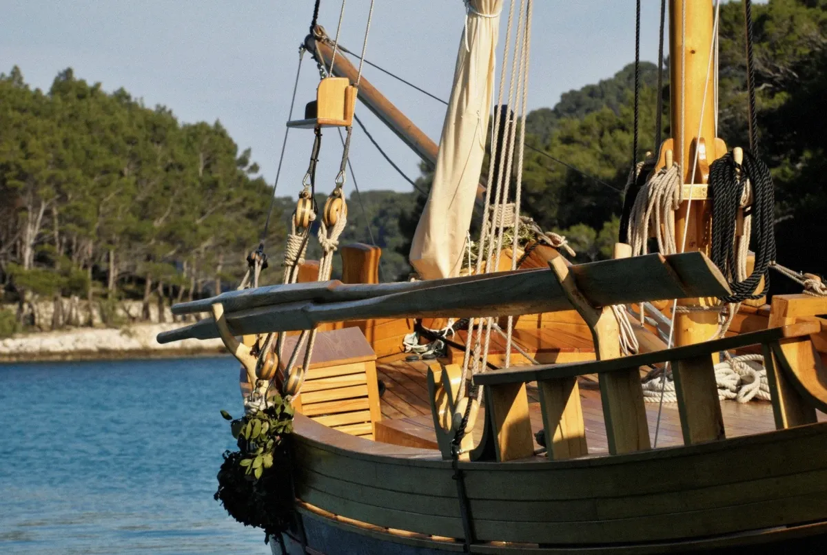 Traditional wooden boat deck with teak planks, the classic Mediterranean gozzo style rented and chartered in Cagliari